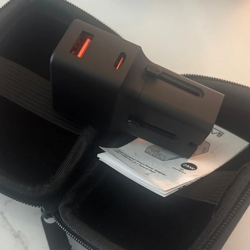 TUMI universal power adapter and case